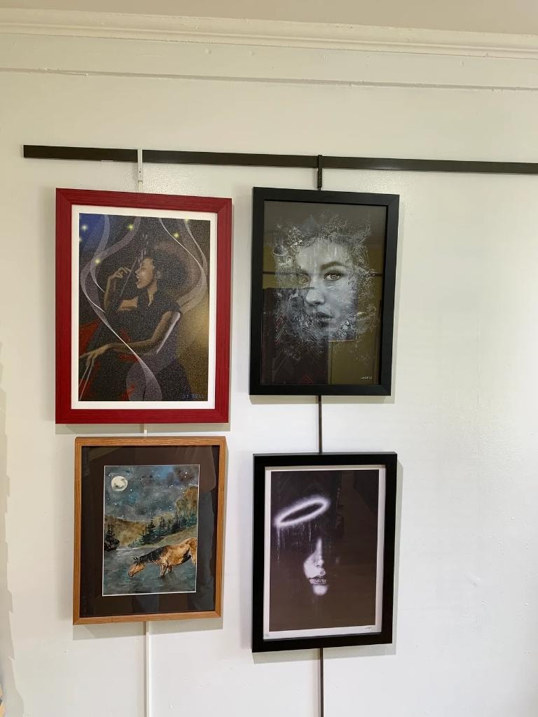 Framed artwork collection hanging on wall